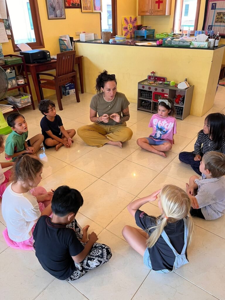 Children learning with a teacher at Shining Stars School Kamala, an established kindergarten in Phuket since 2008