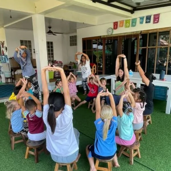 Children taking part in outdoor movement at Shining Stars School Kamala