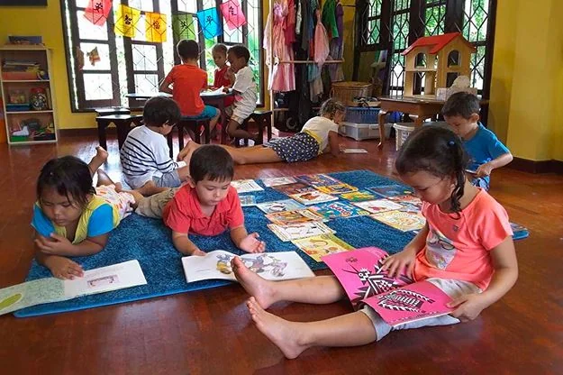 Children listening to a story at Shining Stars School Kamala