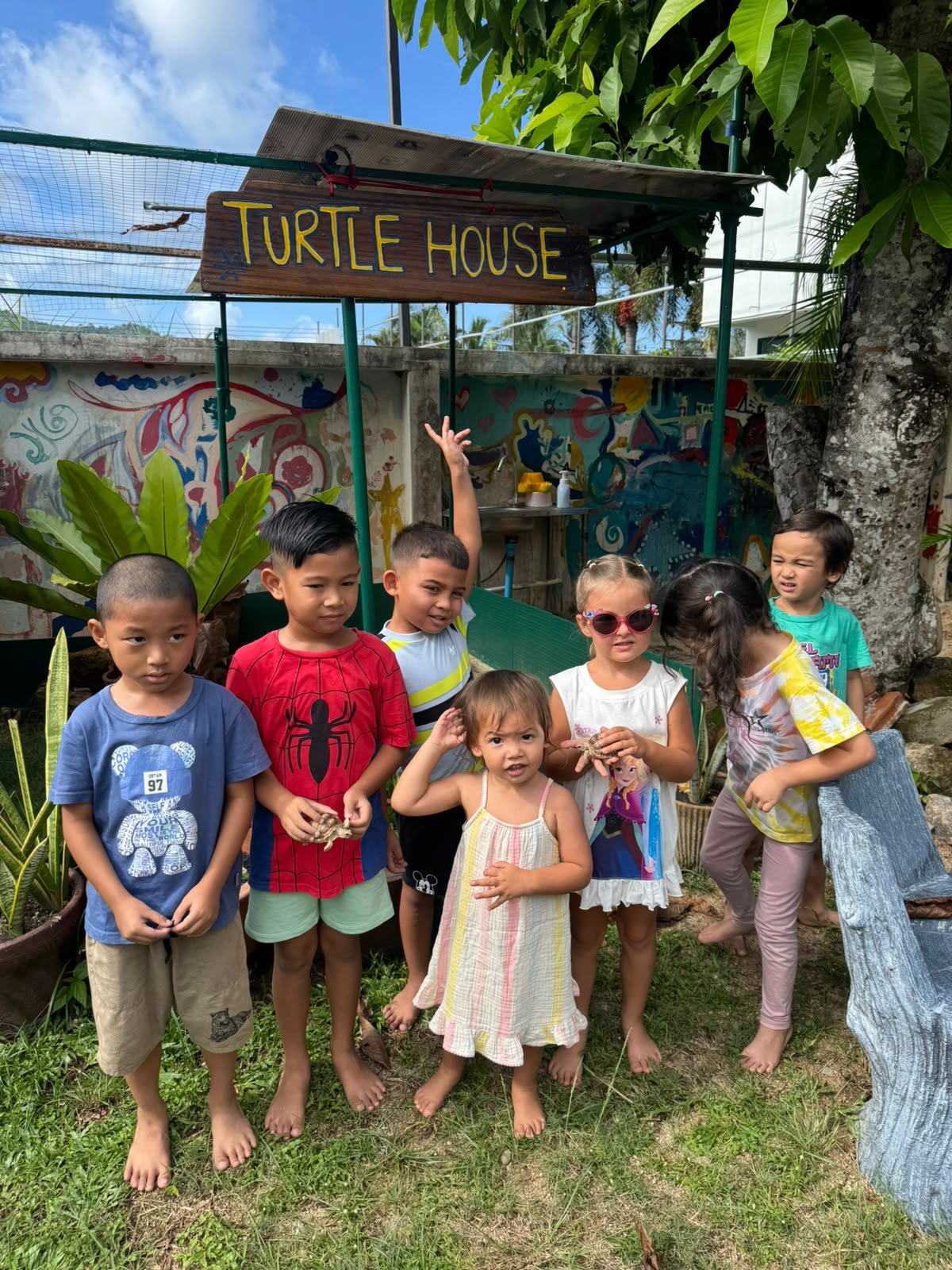 Children learning with tortoises at Shining Stars School Kamala in Phuket